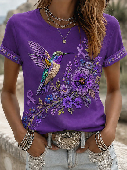 T-shirt de soutien violet à imprimé floral et colibri pour femmes